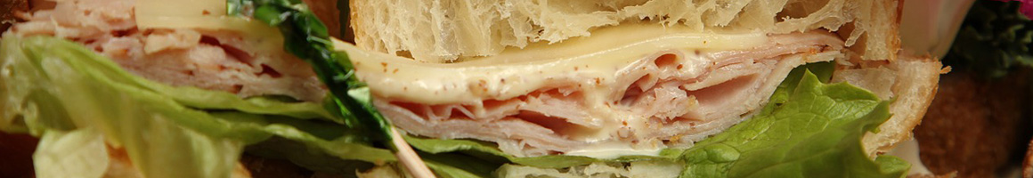 Eating Sandwich at Croque Famous Sandwiches restaurant in Scottsdale, AZ.